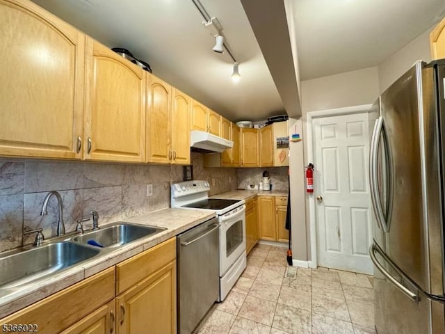 77 Belvidere Ave, Oxford Twp, NJ 07863 - kitchen featuring appliances with stainless steel finishes, under cabinet range hood, light countertops, and decorative backsplash