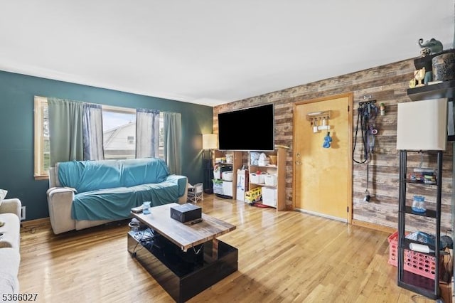 132 N 17th St, Prospect Park Boro, NJ 07508 - living room featuring an accent wall and wood finished floors