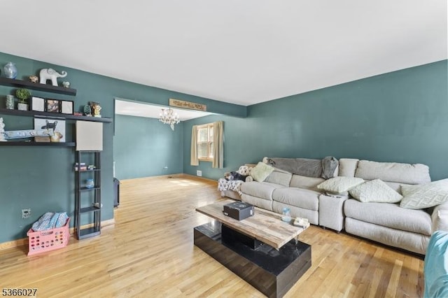 132 N 17th St, Prospect Park Boro, NJ 07508 - living room featuring a chandelier and wood finished floors