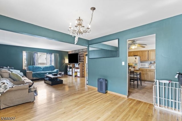 132 N 17th St, Prospect Park Boro, NJ 07508 - living room featuring a chandelier, light wood-type flooring, and a ceiling fan