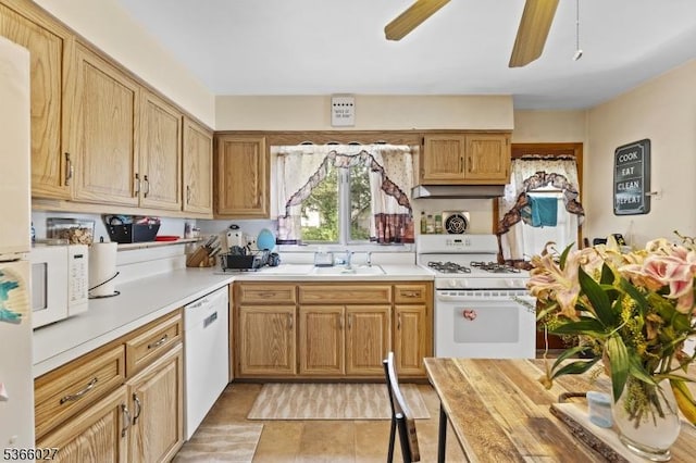 132 N 17th St, Prospect Park Boro, NJ 07508 - kitchen with white appliances, light countertops, a ceiling fan, light tile patterned flooring, and under cabinet range hood