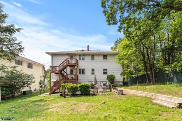 132 N 17th St, Prospect Park Boro, NJ 07508 - back of property featuring a lawn and stairway