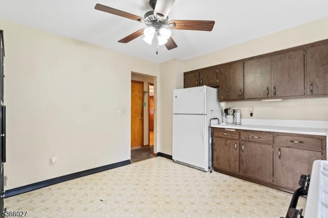 132 N 17th St, Prospect Park Boro, NJ 07508 - kitchen with freestanding refrigerator, light floors, a ceiling fan, stove, and dark brown cabinets