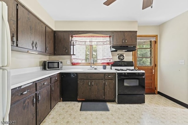 132 N 17th St, Prospect Park Boro, NJ 07508 - kitchen featuring gas range, black dishwasher, stainless steel microwave, under cabinet range hood, and freestanding refrigerator
