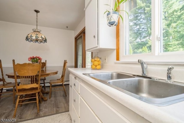 10 Springdale Gardens Rd, Andover Twp, NJ 07860 - kitchen with white cabinetry, light countertops, pendant lighting, and baseboard heating