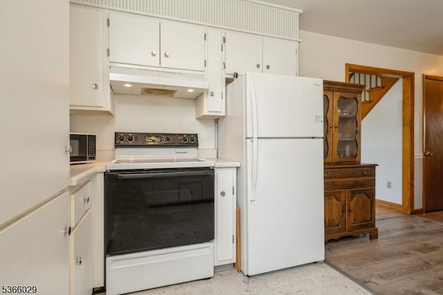 10 Springdale Gardens Rd, Andover Twp, NJ 07860 - kitchen with white appliances, under cabinet range hood, light countertops, and white cabinetry