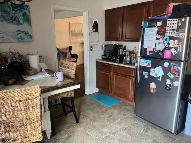 800 Raritan Rd, Clark Twp, NJ 07066 - kitchen featuring freestanding refrigerator and dark brown cabinets