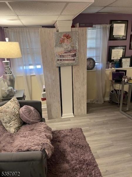 800 Raritan Rd, Clark Twp, NJ 07066 - living area featuring a drop ceiling and wood finished floors