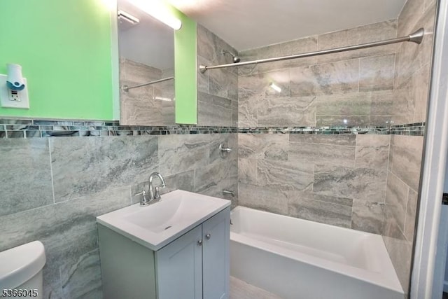23 Howard St, Irvington Twp, NJ 07111 - bathroom featuring washtub / shower combination, vanity, and tile walls