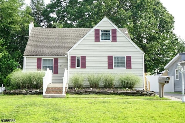 709 Wadsworth Ave, South Plainfield Boro, NJ 07080 - cape cod-style house with a chimney, a front lawn, and a shingled roof