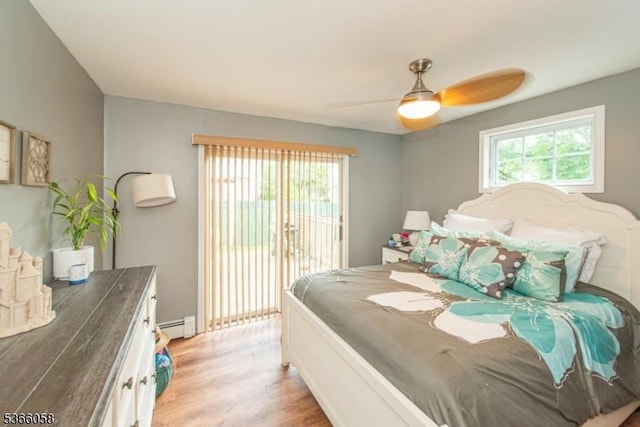 19 Card St, Hamburg Boro, NJ 07419 - bedroom featuring access to outside, multiple windows, light wood-type flooring, and baseboard heating