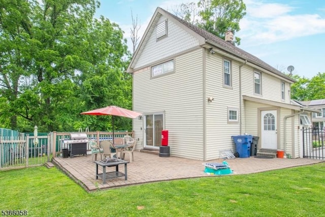 19 Card St, Hamburg Boro, NJ 07419 - rear view of house featuring a chimney, a patio area, and an outdoor fire pit
