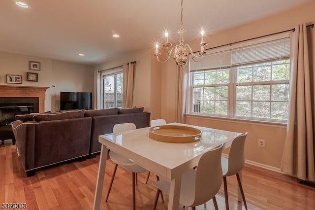 9 Cottage Ct, Berkeley Heights Twp, NJ 07922 - dining room featuring a chandelier, light wood-style floors, recessed lighting, and a glass covered fireplace