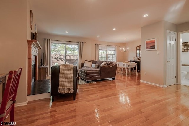 9 Cottage Ct, Berkeley Heights Twp, NJ 07922 - living area with a chandelier, light wood-style flooring, recessed lighting, and a high end fireplace