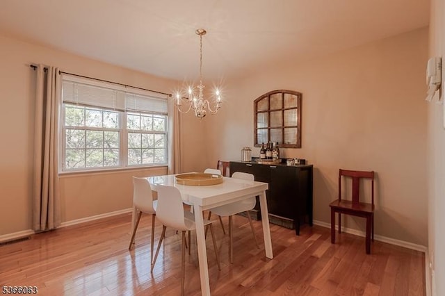 9 Cottage Ct, Berkeley Heights Twp, NJ 07922 - dining space with a chandelier and light wood-style flooring