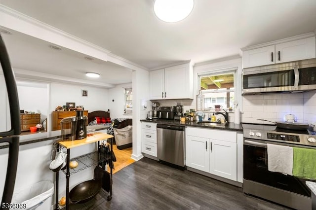 9 Beavers St, High Bridge Boro, NJ 08829 - kitchen with stainless steel appliances, decorative backsplash, white cabinets, and dark wood-type flooring