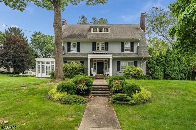 701 Hillcrest Blvd, Phillipsburg Town, NJ 08865 - view of front of house featuring a chimney, a front yard, stucco siding, and french doors