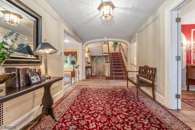 701 Hillcrest Blvd, Phillipsburg Town, NJ 08865 - corridor featuring arched walkways, wood finished floors, and stairway