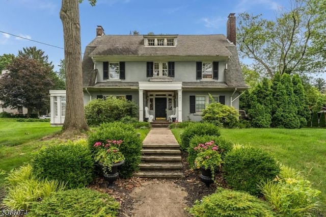 701 Hillcrest Blvd, Phillipsburg Town, NJ 08865 - view of front facade featuring stucco siding, a chimney, and a front lawn