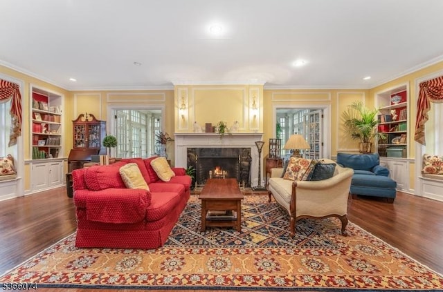 701 Hillcrest Blvd, Phillipsburg Town, NJ 08865 - living room with crown molding, built in shelves, wood finished floors, and a premium fireplace