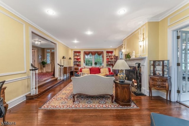 701 Hillcrest Blvd, Phillipsburg Town, NJ 08865 - living area with wood finished floors, ornamental molding, built in features, a lit fireplace, and recessed lighting