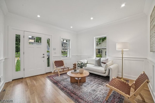 151 Center Ave, Chatham Boro, NJ 07928 - living room with a decorative wall, light wood-style floors, ornamental molding, a wainscoted wall, and recessed lighting