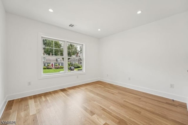 151 Center Ave, Chatham Boro, NJ 07928 - empty room featuring light wood-type flooring and recessed lighting