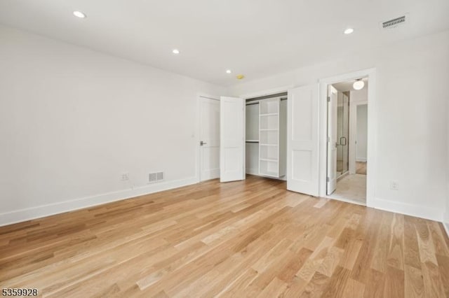 151 Center Ave, Chatham Boro, NJ 07928 - unfurnished bedroom featuring light wood-type flooring, recessed lighting, and connected bathroom