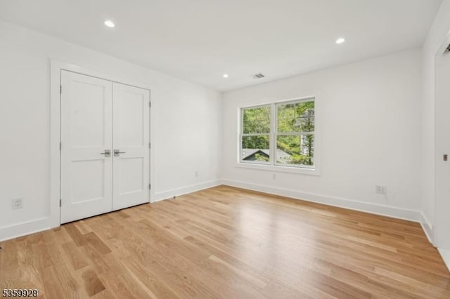 151 Center Ave, Chatham Boro, NJ 07928 - unfurnished bedroom featuring light wood-style floors, recessed lighting, and a closet