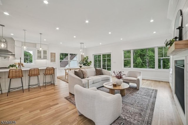 151 Center Ave, Chatham Boro, NJ 07928 - living area featuring a fireplace, light wood-style flooring, healthy amount of natural light, and recessed lighting