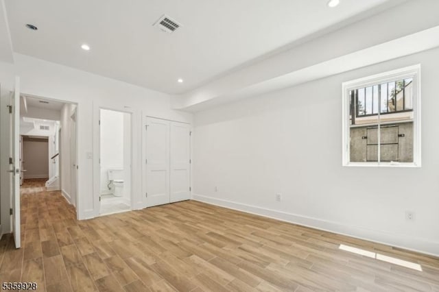 151 Center Ave, Chatham Boro, NJ 07928 - unfurnished bedroom featuring light wood-style flooring, recessed lighting, connected bathroom, and a closet