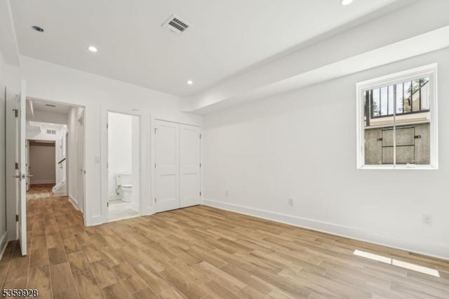 151 Center Ave, Chatham Boro, NJ 07928 - unfurnished bedroom featuring light wood-style flooring, ensuite bathroom, and recessed lighting