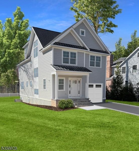 151 Center Ave, Chatham Boro, NJ 07928 - view of front of house featuring a standing seam roof, asphalt driveway, a metal roof, an attached garage, and a front lawn