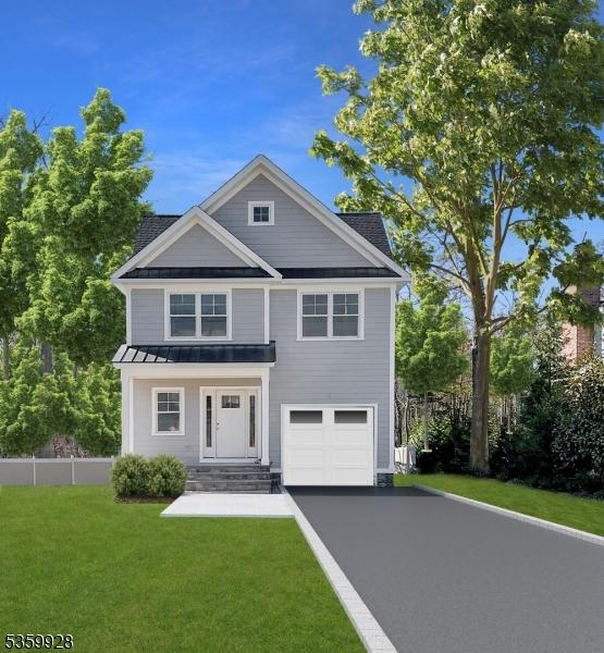 151 Center Ave, Chatham Boro, NJ 07928 - view of front of home featuring a standing seam roof, asphalt driveway, a metal roof, and a garage