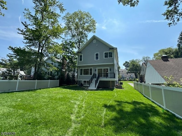 151 Center Ave, Chatham Boro, NJ 07928 - rear view of house with a fenced backyard and stairway