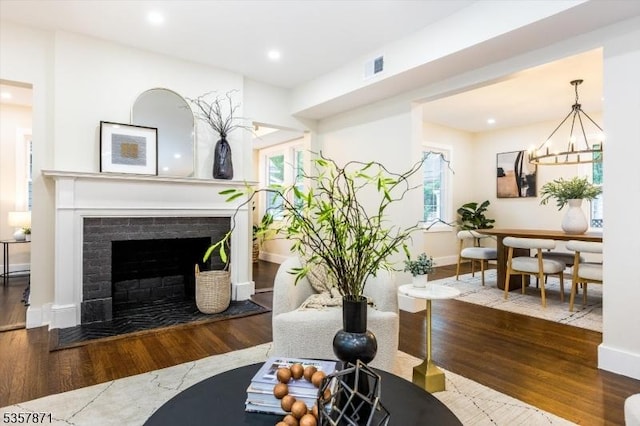 121 S Kingman Rd, South Orange Village Twp, NJ 07079 - living room with wood finished floors, a fireplace, recessed lighting, and a chandelier
