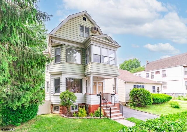 1432 Munn Ave, Hillside Twp, NJ 07205 - view of front facade featuring a front lawn