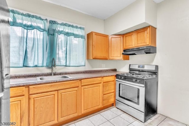 1432 Munn Ave, Hillside Twp, NJ 07205 - kitchen with gas stove, under cabinet range hood, and light tile patterned floors