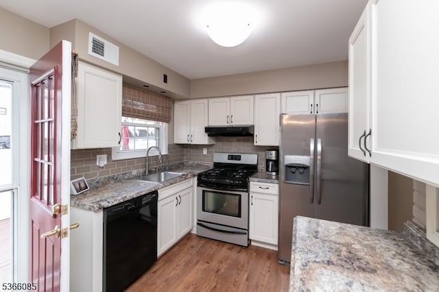 167 Riva Dr, Mansfield Twp, NJ 07840 - kitchen featuring appliances with stainless steel finishes, white cabinetry, backsplash, and light wood-style floors