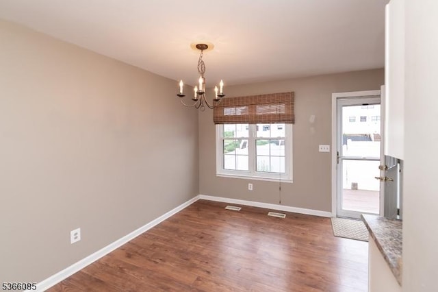 167 Riva Dr, Mansfield Twp, NJ 07840 - unfurnished dining area with wood finished floors and a chandelier