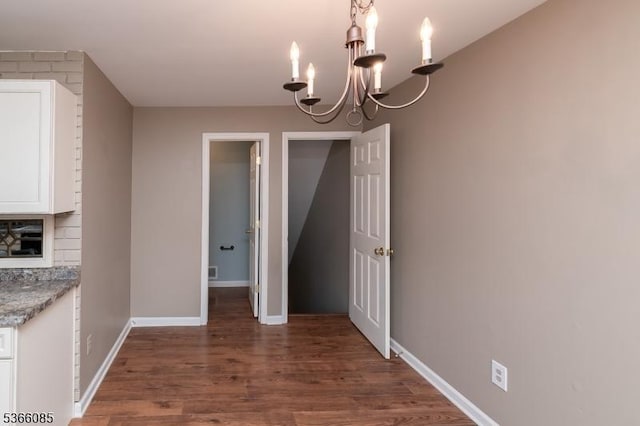 167 Riva Dr, Mansfield Twp, NJ 07840 - unfurnished dining area featuring dark wood-style flooring and a chandelier