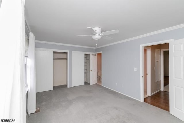 167 Riva Dr, Mansfield Twp, NJ 07840 - unfurnished bedroom featuring carpet flooring, crown molding, two closets, and ceiling fan