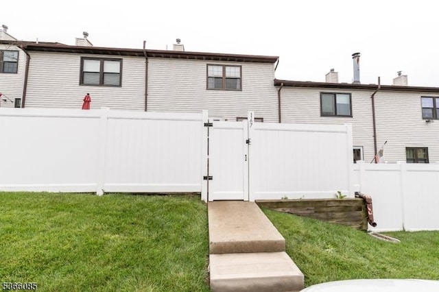 167 Riva Dr, Mansfield Twp, NJ 07840 - rear view of house with a gate and a chimney