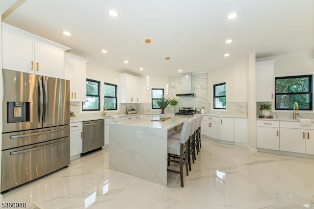24 Hillcrest Rd, Mountain Lakes Boro, NJ 07046 - kitchen with stainless steel appliances, wall chimney range hood, decorative backsplash, recessed lighting, and plenty of natural light