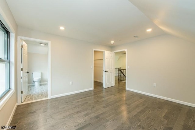 24 Hillcrest Rd, Mountain Lakes Boro, NJ 07046 - unfurnished bedroom with dark wood-style floors, recessed lighting, a walk in closet, vaulted ceiling, and ensuite bath