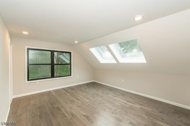 24 Hillcrest Rd, Mountain Lakes Boro, NJ 07046 - additional living space featuring a skylight, wood finished floors, lofted ceiling, and recessed lighting