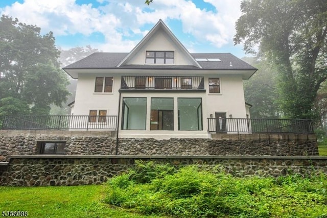 24 Hillcrest Rd, Mountain Lakes Boro, NJ 07046 - back of property with a balcony and stucco siding