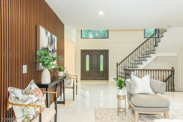24 Hillcrest Rd, Mountain Lakes Boro, NJ 07046 - foyer entrance with marble tiled floors, stairs, a decorative wall, and recessed lighting