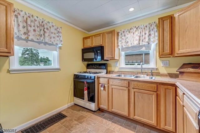 159 Aurora St, Lopatcong Twp, NJ 08865 - kitchen with black microwave, white range with gas cooktop, light countertops, light brown cabinetry, and crown molding