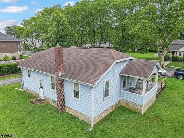 159 Aurora St, Lopatcong Twp, NJ 08865 - rear view of property with roof with shingles, a chimney, and a yard